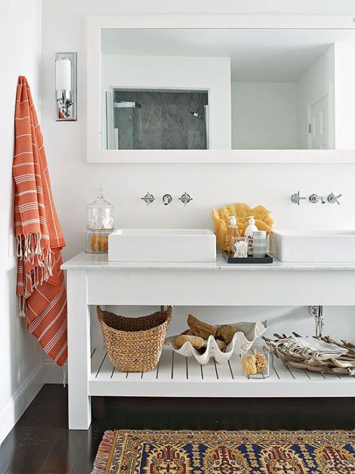 A coastal bathroom with a clean look and open storage