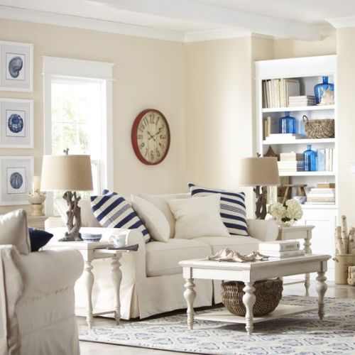 Coastal skirted sofa in an all white, monochromatic color palette