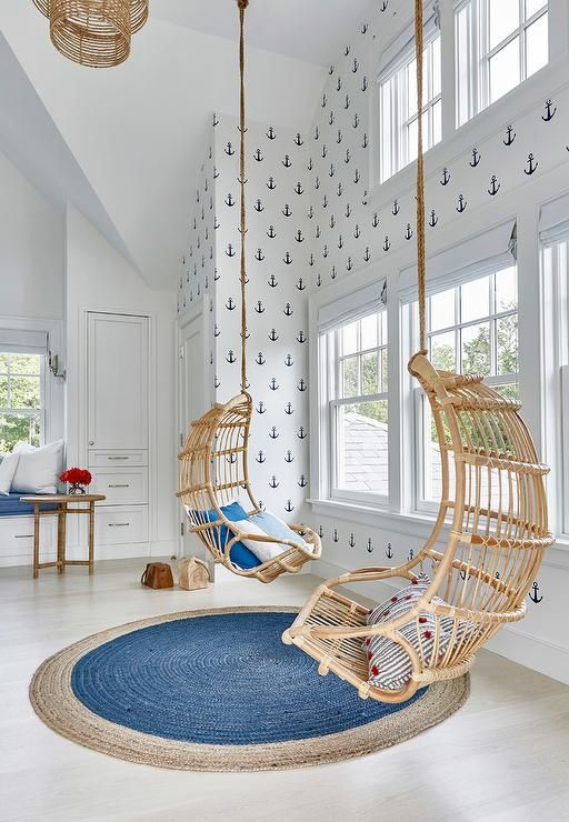 Swinging chairs in a kids coastal bedroom